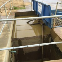 Safety railings around water tank